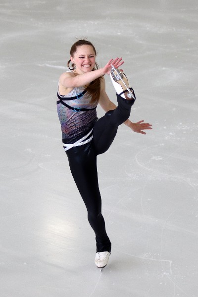 Figure skater doing a high kick