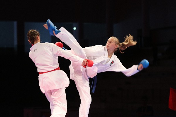 Ura mawashi geri in karate kumite fight