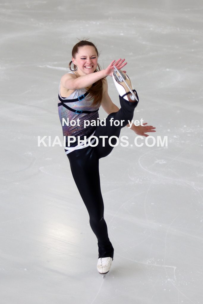 Figure skater doing a high kick