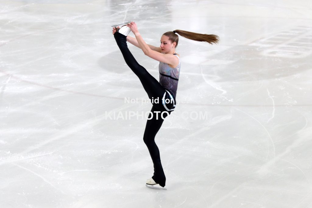 Figure skater performing an upright spin