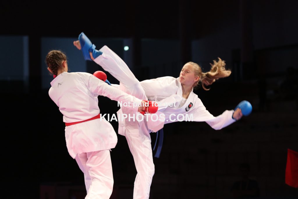 Ura mawashi geri in karate kumite fight