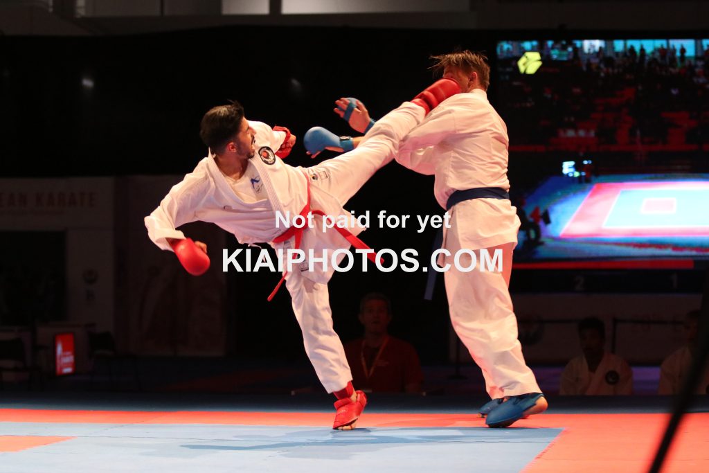 Ura mawashi geri score in karate kumite fight